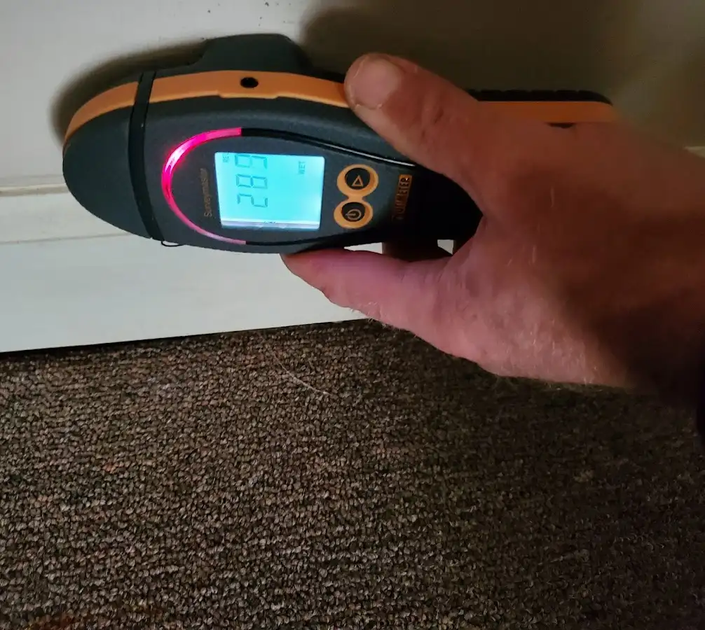 Moisture detection at baseboard during Storm Damage Restoration in Westwood Lakes